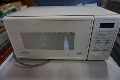 WHITE GOLDSTAR MICROWAVE AND OFFICE PHONES - Big Valley Auction