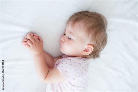 One year old baby girl sleeping Stock Photo | Adobe Stock