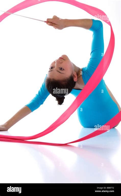 Rhythmic gymnastics, female gymnast doing routine with ribbon Stock ...