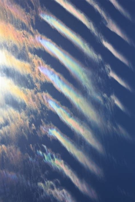 Iridescent Clouds Iridescent clouds are a... - Science Llama