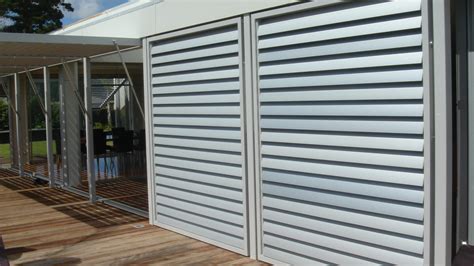 Aluminum Sliding Louver Shutters for outdoor patio shade in Houston.