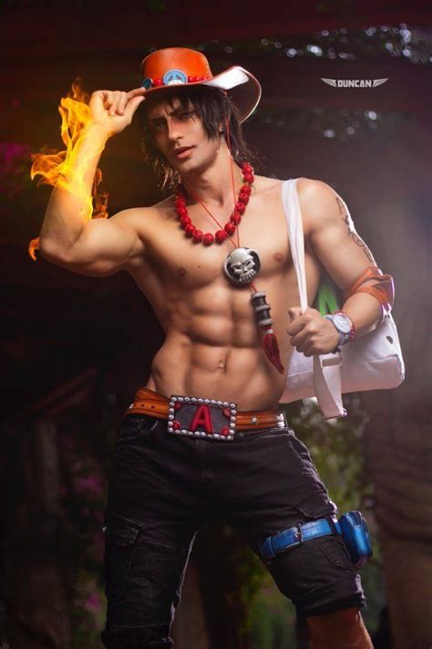 a man with no shirt on holding a fire stick and wearing a hat while ...