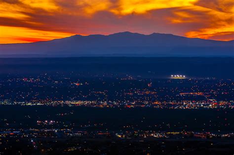 A fiery sunset with 11,306 foot (3,446 meters) Mount Taylor in background, Albuquerque, New ...