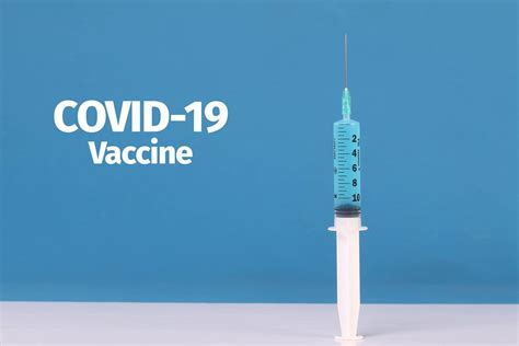 Ampule with Covid-19 vaccine on calendar - Creative Commons Bilder