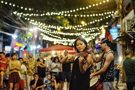 Street music performance in Hanoi's Walking Street during Christmas time. Do you wonder how ...