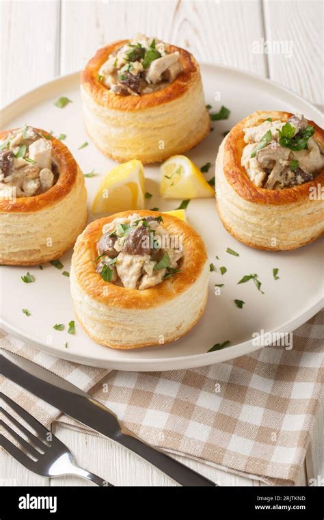 Vol au vent baked puff pastry with chicken, mushroom and cream closeup ...