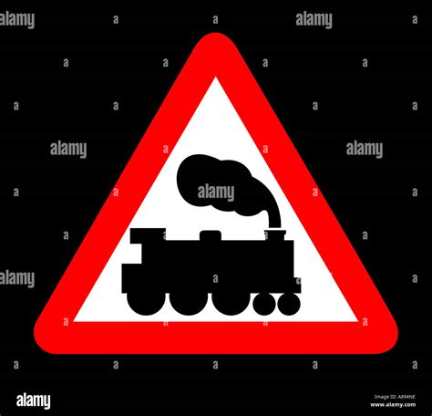 Level Crossing Road sign on black background Stock Photo - Alamy