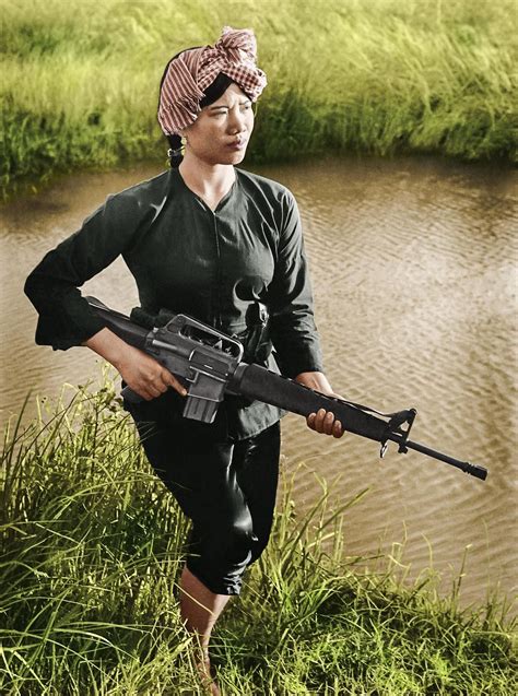 Vietcong woman patrolling along the Mekong delta | Vietnam war, Vietnam ...