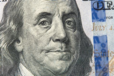 Benjamin Franklin's face on the US 100 dollar bill. Franklin on one ...