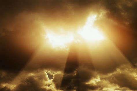 Brilliant Beams Of Light Break Through Dark Thundery Clouds Stock Photo - Download Image Now ...