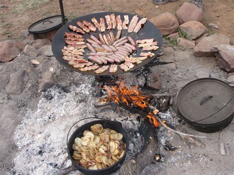 This is real camp fire cooking! No tin foil packets. Cast iron Dutch ...