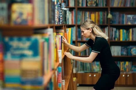 Premium Photo | Student searching for books in a library