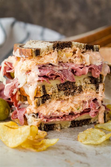 Easy HOMEMADE Reuben! Rye bread slices piled with meat, sauerkraut and a tangy homemade Russian ...