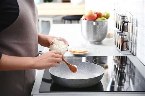 Woman Putting Coconut Oil on Frying Pan in Kitchen Stock Image - Image of fresh, aroma: 116724697