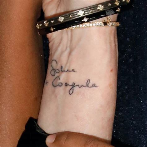 JK Rowling's 'Solve et Coagula' tattoo.