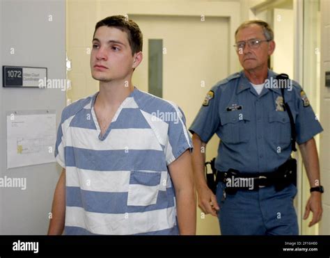 Edwin Hall is escorted to a video court appearance on Thursday, June 7 ...