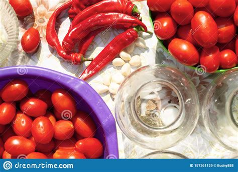 `Pickling Vegetables Process` Canning the Tomatoes and Chili Pepper. Glass Jars with Tomatoes ...