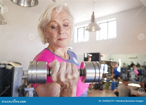 Senior Woman Exercising with Weights in Gym Stock Image - Image of ...