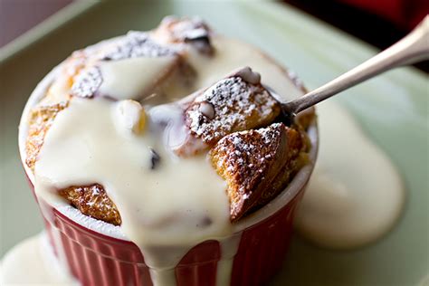 Challah Bread Puddings with Golden Raisins and Eggnog-Spiced Rum Sauce