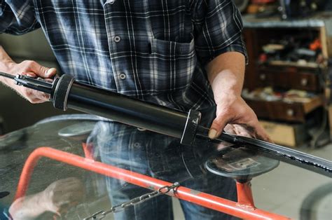 Premium Photo | Repair and replacement of the windshield of the car.