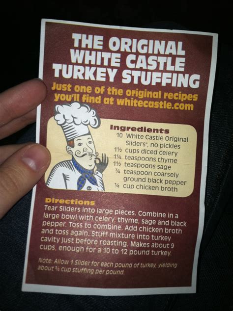 a person holding up a white castle turkey stuffing packet in their left ...