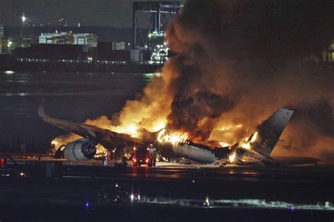 Planes on fire after collision at Japanese airport, killing 5 - masslive.com