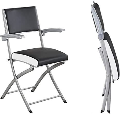 two folding chairs side by side, one black and the other white
