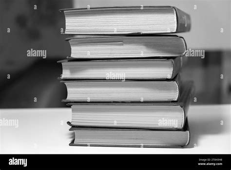 Stack of books on a white background. One book is yellow Stock Photo - Alamy