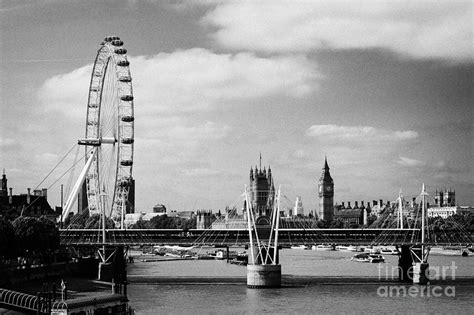 general view of the hungerford bridge london eye and houses of parliament river thames London ...