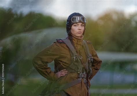 A young female pilot in uniform of Soviet Army pilots during the World ...