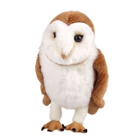 an owl stuffed animal standing on its hind legs with one eye open and the other half closed