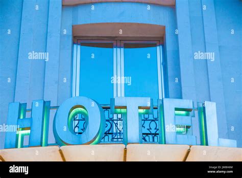 Hotel facade illuminated at night Stock Photo - Alamy