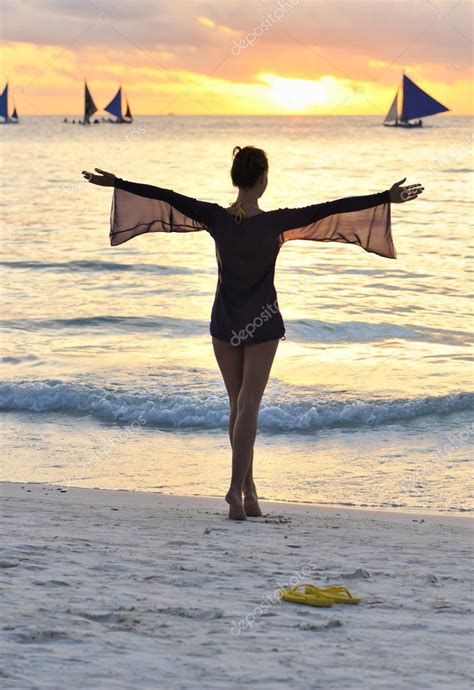 Girl on a beach at sunset — Stock Photo © haveseen #4898160