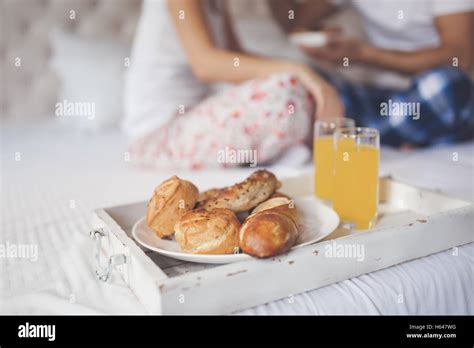 Romantic couple breakfast in bed on honeymoon Stock Photo - Alamy