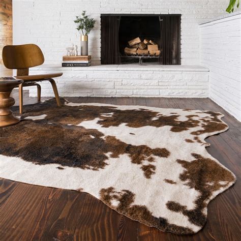 Add a touch of rustic charm to your living room or den with the Rawhide Animal Print Rug. This ...