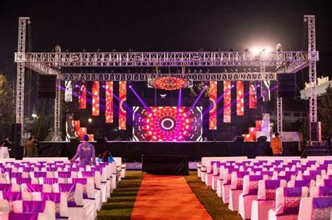 Purple and White Outdoor Stage Decor for Memorable Weddings and Events
