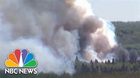 Canadian wildfires force thousands to evacuate - YouTube