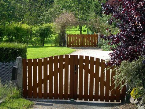 Simple wooden gates in a beautiful Normandy garden. | Wooden gate ...