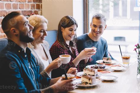 People eating in a restaurant, laughing 9367490 Stock Photo at Vecteezy