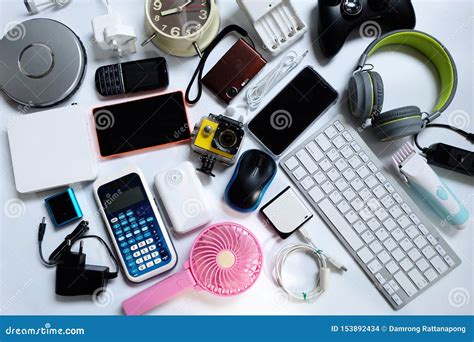 Many Used Modern Electronic Gadgets for daily Use on White Floor, Reuse ...