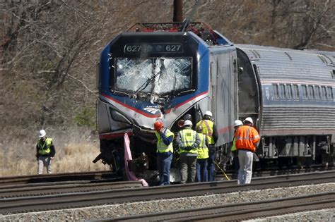 Amtrak train struck backhoe at 106 mph in fatal derailment, officials say - CBS News