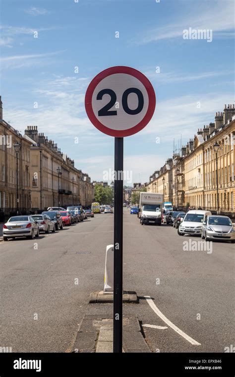 A twenty (20 MPH) Mile Per Hour Speed restriction sign post central in ...