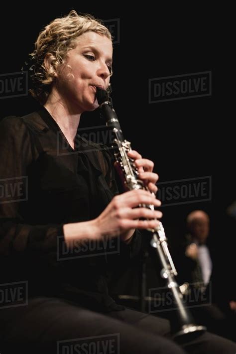 Clarinet player in orchestra - Stock Photo - Dissolve