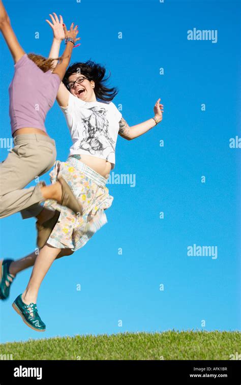 Friends giving high five Stock Photo - Alamy