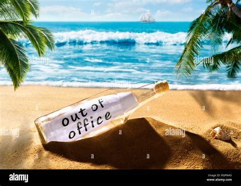 Message in a bottle with the note out of office on a beautiful tropical beach Stock Photo - Alamy