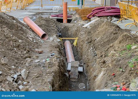 Laying Of Pipes With Pipe-laying Barge Crane Near The Shore. Descent Of The Pipeline To A Bottom ...