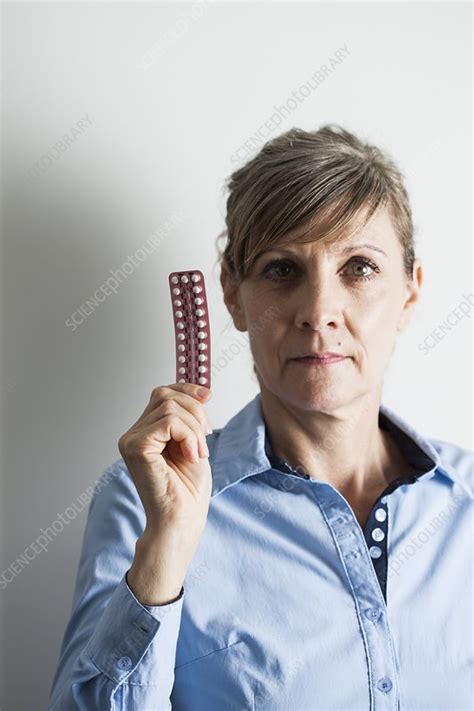 Menopausal woman with hormone replacement therapy pills - Stock Image ...