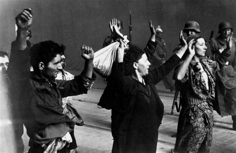 WWII --- Suspected Jewish resistance members captured by German soldiers at the Warsaw Ghetto ...