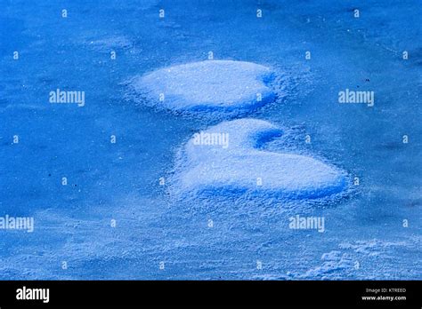 piece of snow i shape of heart Stock Photo - Alamy