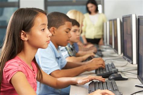 Elementary Students Working at Computers in Classroom Stock Photo - Image of five, california ...